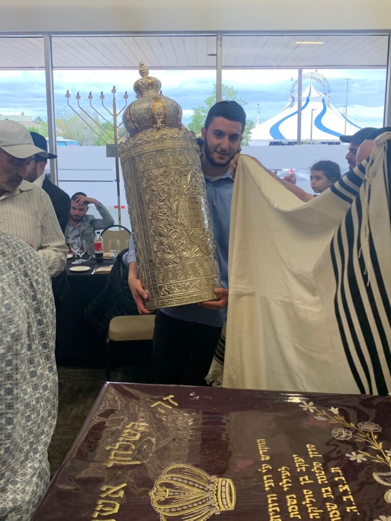 A Sefer Torah held during services at the Israeli Centre