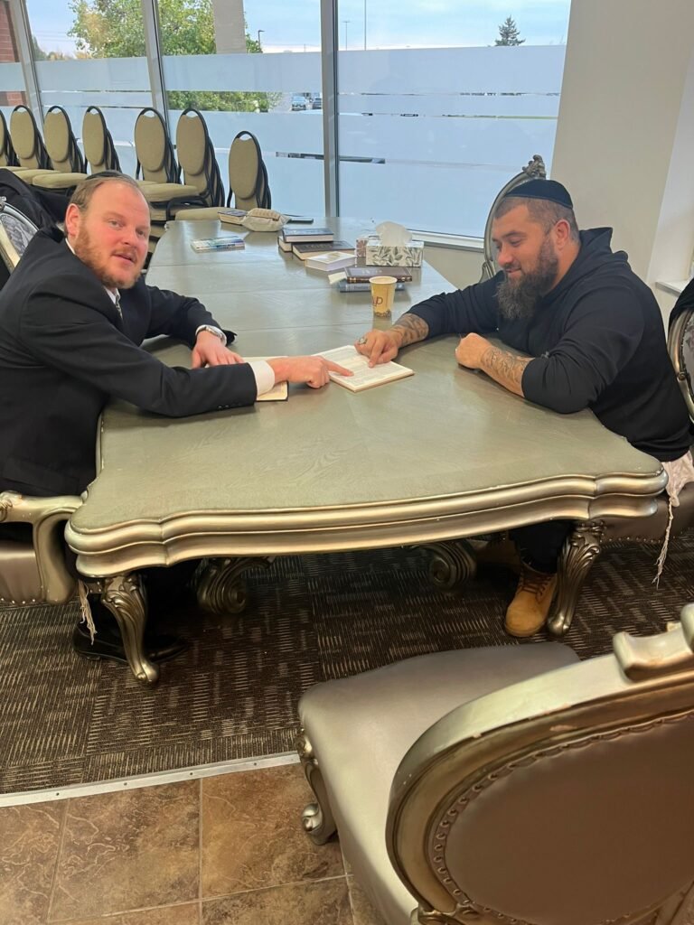 Rabbi MG learning one to one with a member of the community